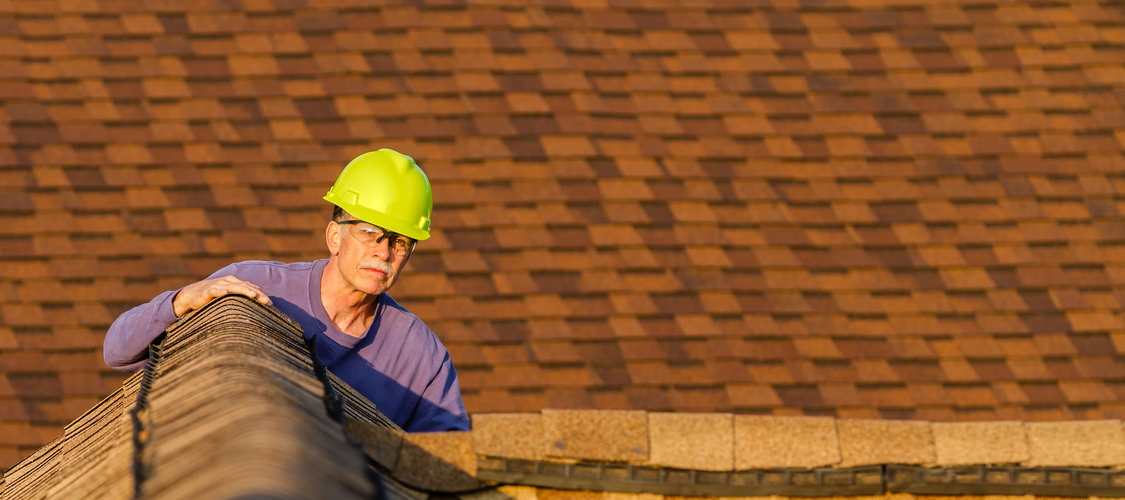 Home inspector checking a roof