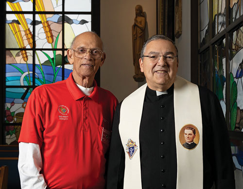 Manny Joia, past grand knight of Father Oliver McGivern Council 10494 in Apple Valley, Calif., stands with Father Delwyn Haroldson in Our Lady of the Desert Catholic Church Feb. 6. Joia, who was in a coma following surgery, made a remarkable recovery after Father Haroldson prayed at his bedside for Father McGivney&rsquo;s intercession. (Photo by Christine Bartolucci)
