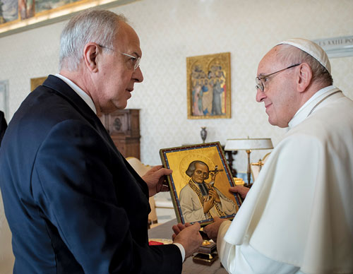 Supreme Knight Carl Anderson presents Pope Francis with an icon of St. Jean Vianney