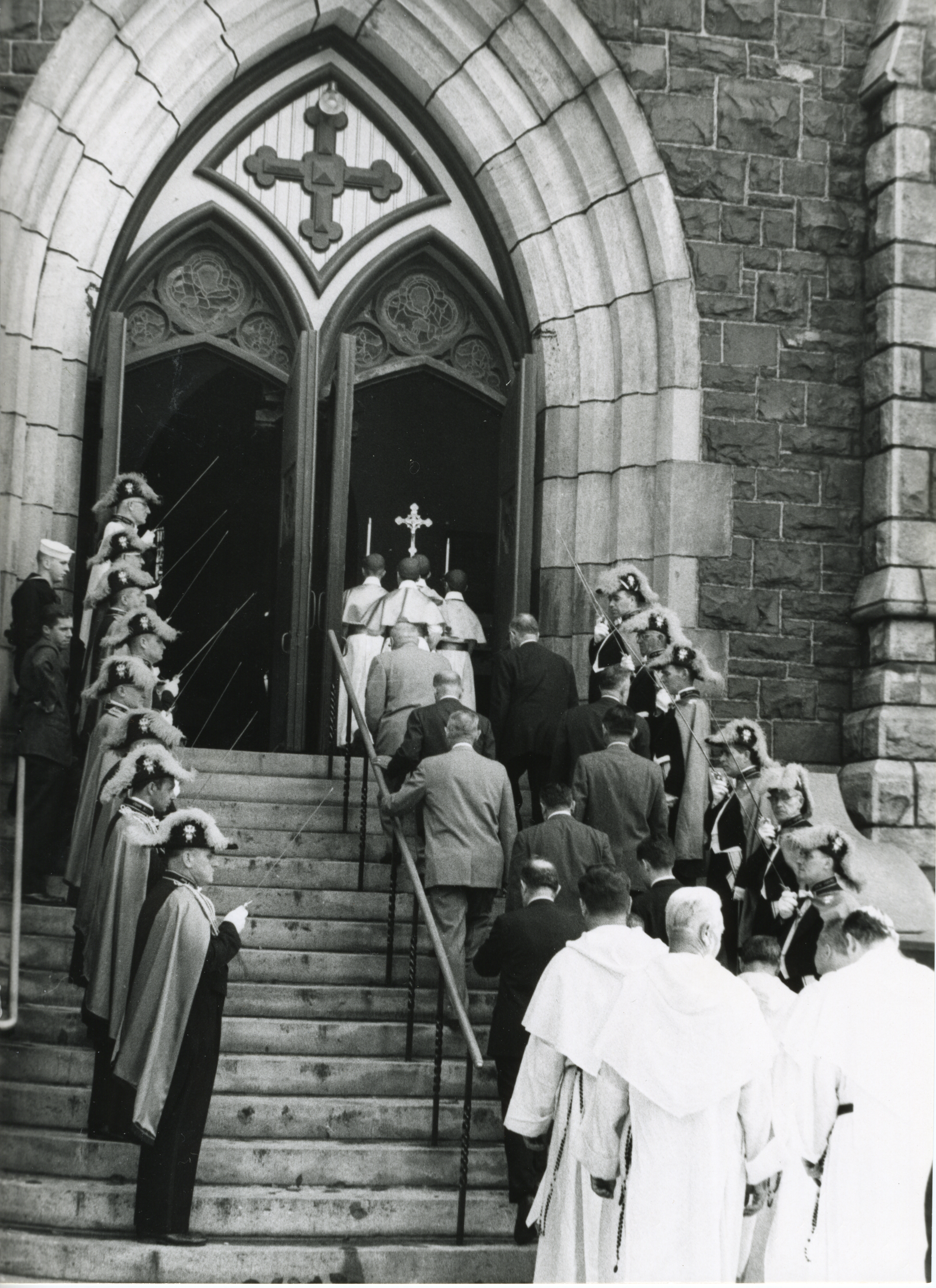 Fourth Degree Color Guard lines procession into St. Mary's Church for blessing plaque marking gift of altar as memorial to Father Michael J. McGivney.