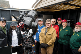 Jim Surman (in red) and other Knights from Assembly 940 gather with astronomy volunteer Rich Dollish (center) and several veterans in the new Sky Shed Observatory.