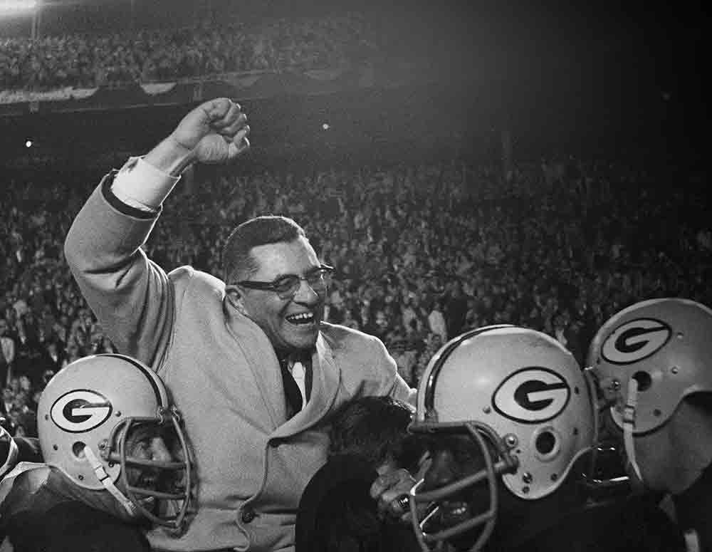 Green Bay Packers head coach Vince Lombardi celebrates after winning the NFL championship game Jan. 1, 1967, in Dallas. A few weeks later, Lombardi&rsquo;s Packers won the AFL-NFL championship game, now known as Super Bowl I. They repeated the feat the next year. In 1970, the Super Bowl trophy was renamed in honor of Lombardi.