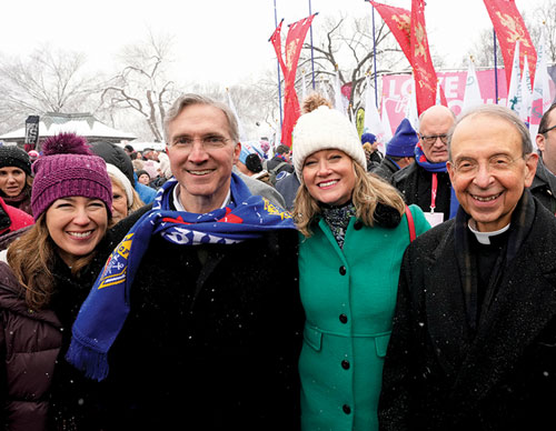 Supreme Knight Patrick Kelly and his wife, Vanessa (left), march down Washington&rsquo;s Constitution Avenue with Jeanne Mancini, president of the March for Life, and Supreme Chaplain Archbishop William Lori of Baltimore. (Photo by Paul Haring)