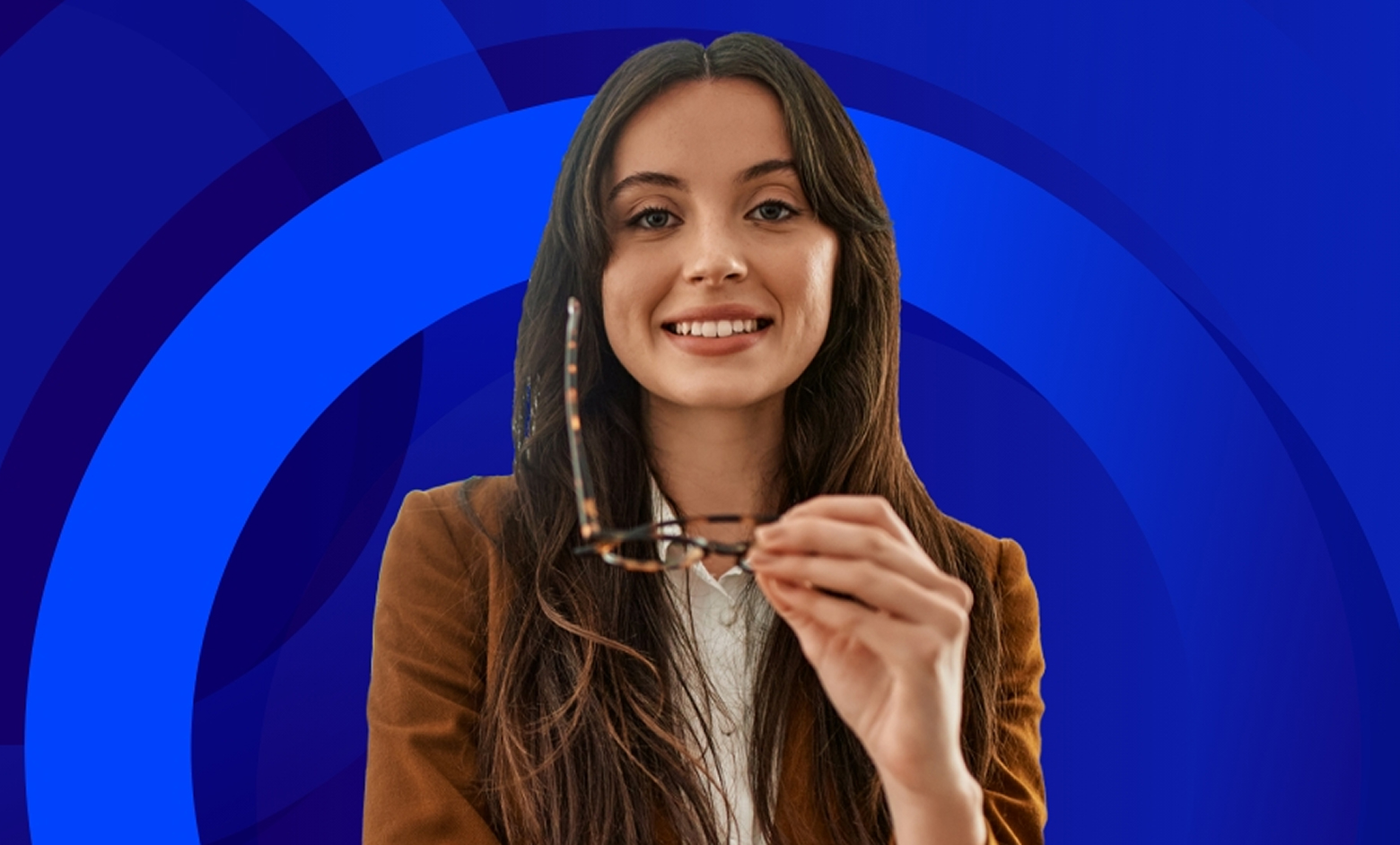 A smiling woman with long brown hair and a brown jacket holds a pair of tortoiseshell-rimmed glasses in front of her. The background is a vibrant blue with concentric circular patterns.