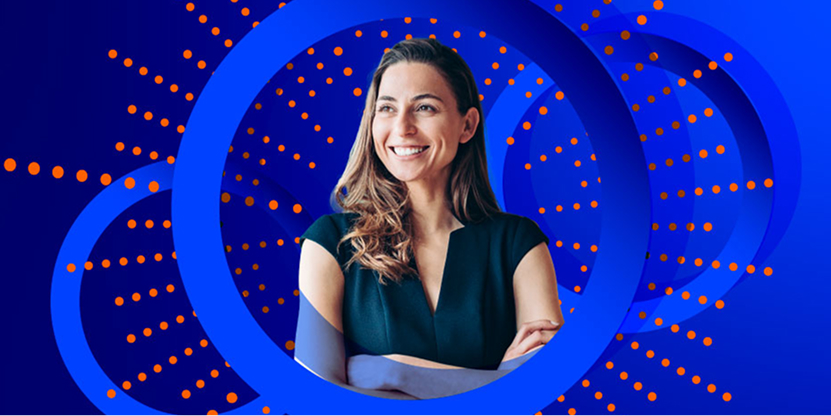 A smiling woman in a dark top stands with her arms crossed, looking away and slightly up. She is framed by two large blue concentric circles and a vibrant blue background with radiating orange-dotted lines.