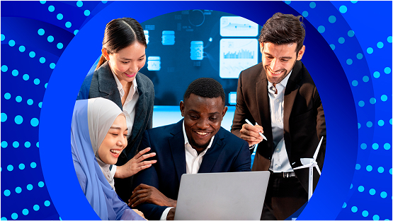 A diverse group of four professionals smile and look down at a laptop screen together in an office setting. They are framed by a large blue circle.