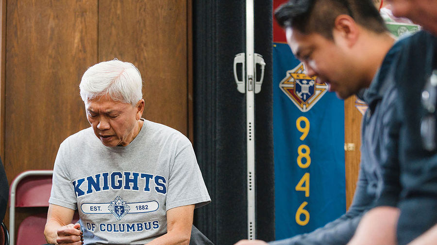 Past State Deputy Michael Yeo (left) and Jamey Guerrero, state director of evangelization and faith formation, join other men in praying the rosary during a Cor event hosted by St. Joseph Council 9846 in Port Moody, British Columbia, on June 4. (Photo by Sandra Leung/Yaletown Photography)