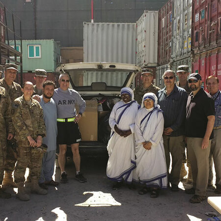 Members of the Afghanistan round table and other personnel delivering supplies to local Missionaries of Charity sisters.