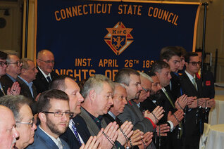 Men participate in the exemplification of charity