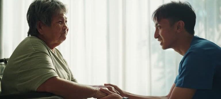 patient holding hands with occupational therapist