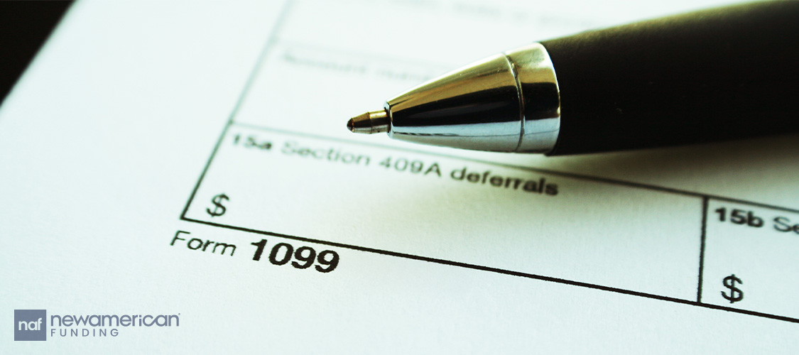 A 1099 form with a pen on it.