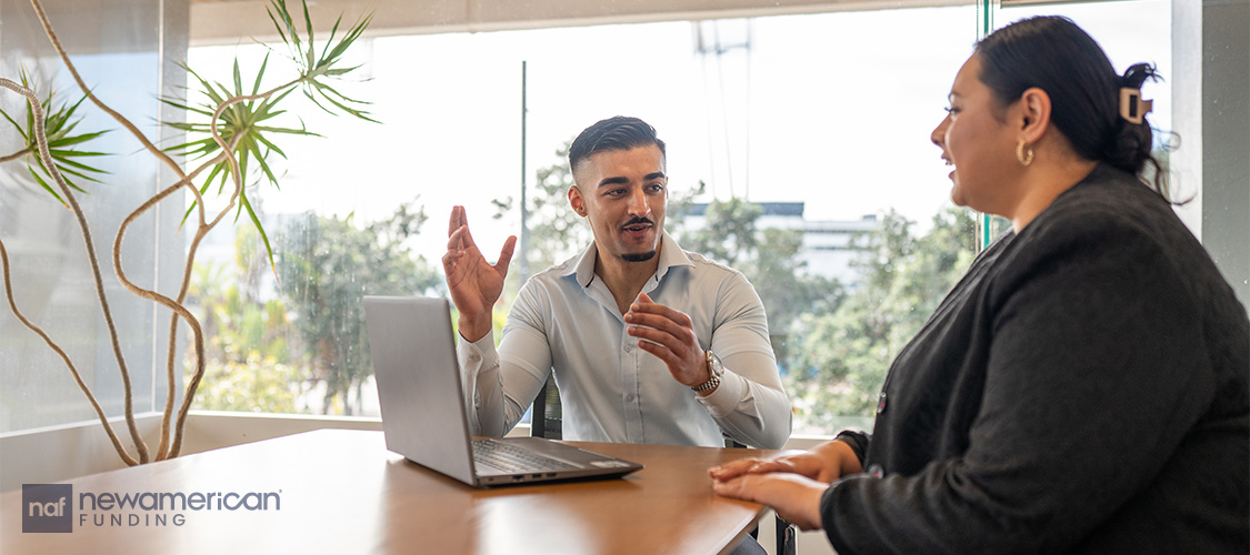 Someone meeting with a loan officer.