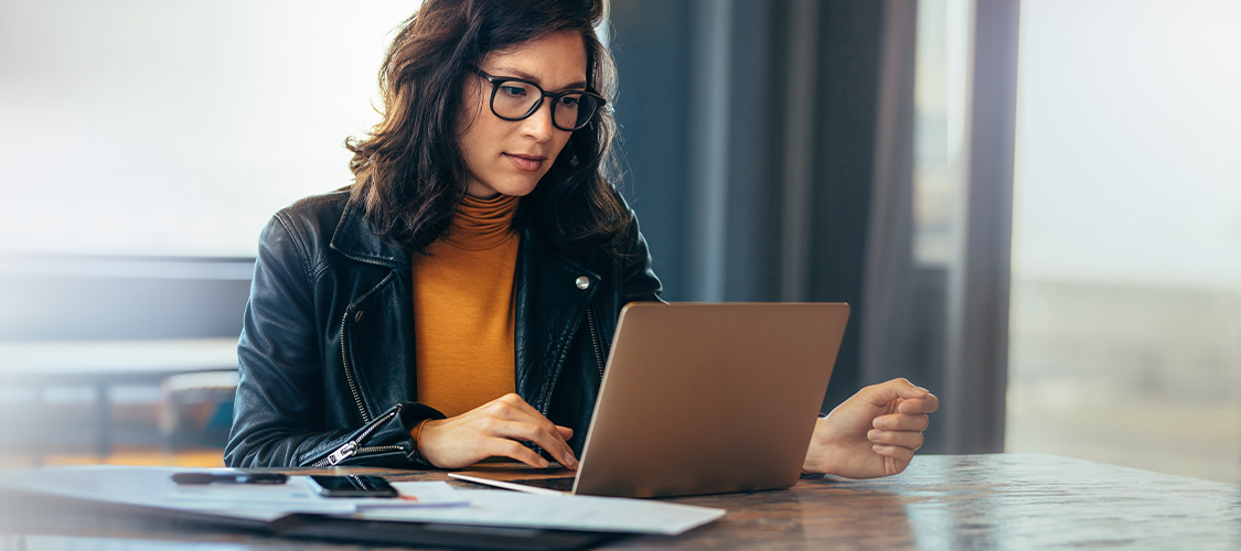 A person sitting at a laptop