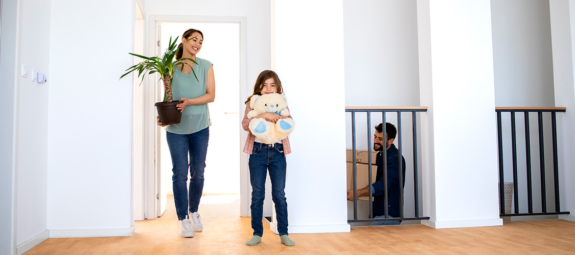 A family climbing the stairs in their home