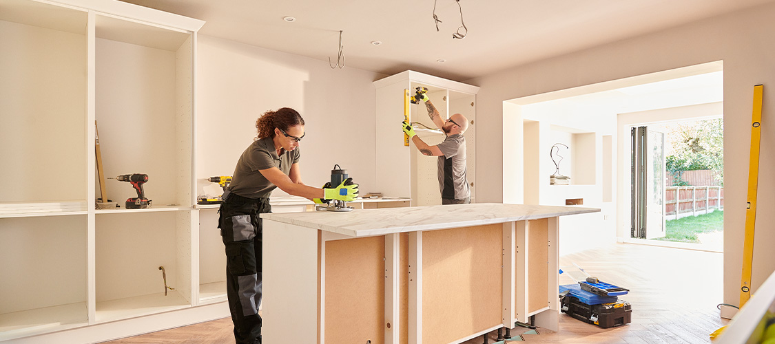 Workers renovating a kitchen