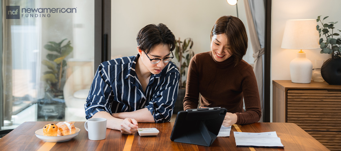 A couple looking at paperwork.