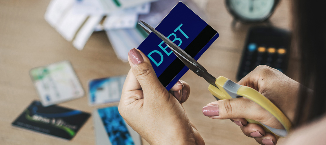 Someone cutting up credit cards.