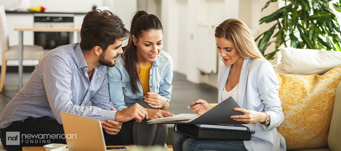 A couple meeting with a loan officer.