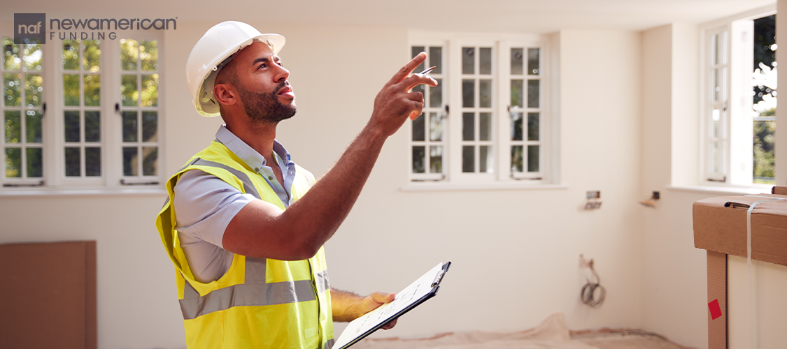 A worker looking at the inside of a home.