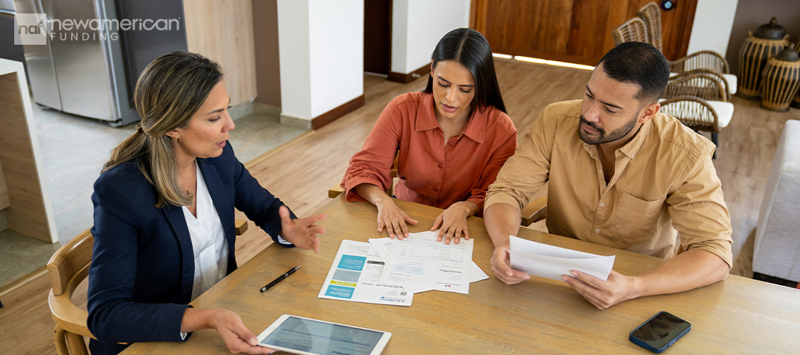A couple meeting with a loan officer.