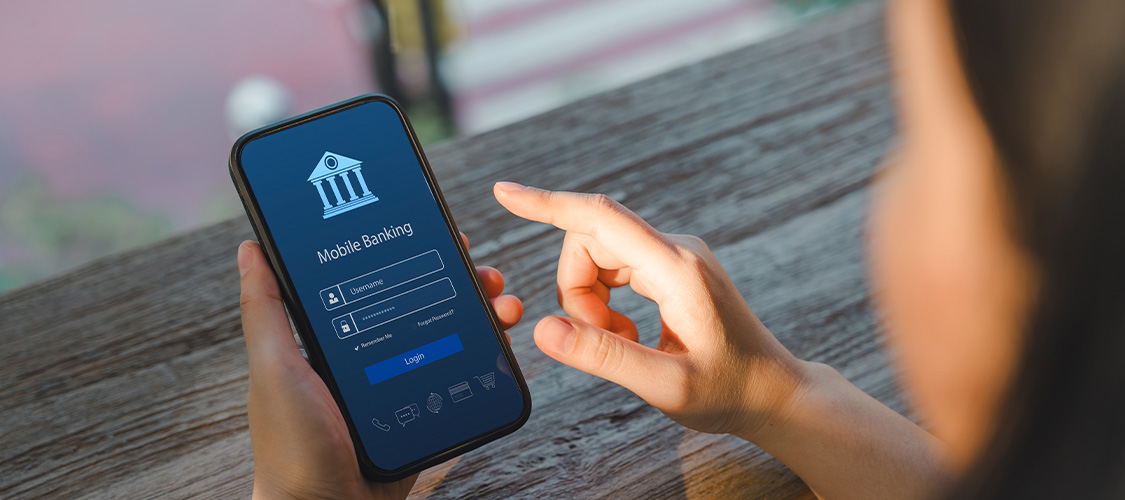 Someone looking at banking information on their phone