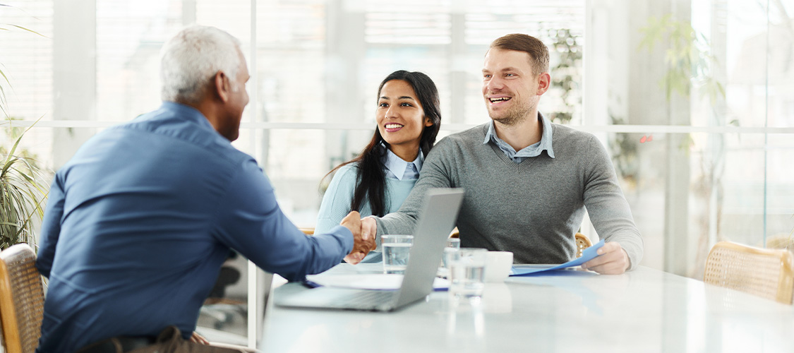 A happy couple buying a home