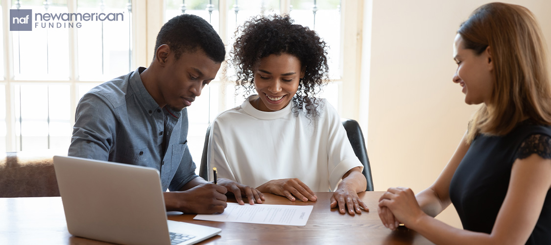 A couple meeting with a loan officer.