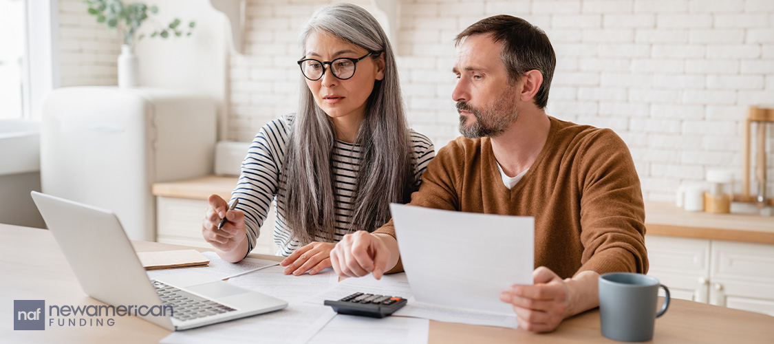 Mortgage application/financial documents that someone is looking at