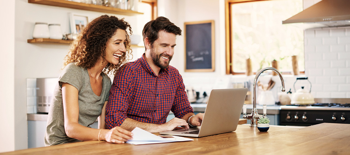 A couple sitting at a computer