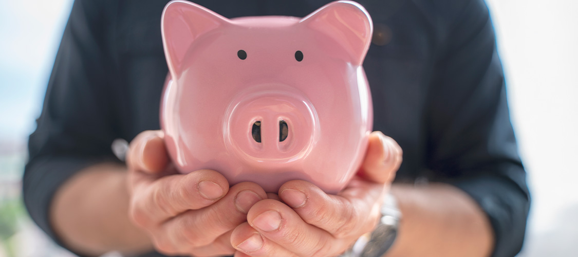A person holding a piggy bank