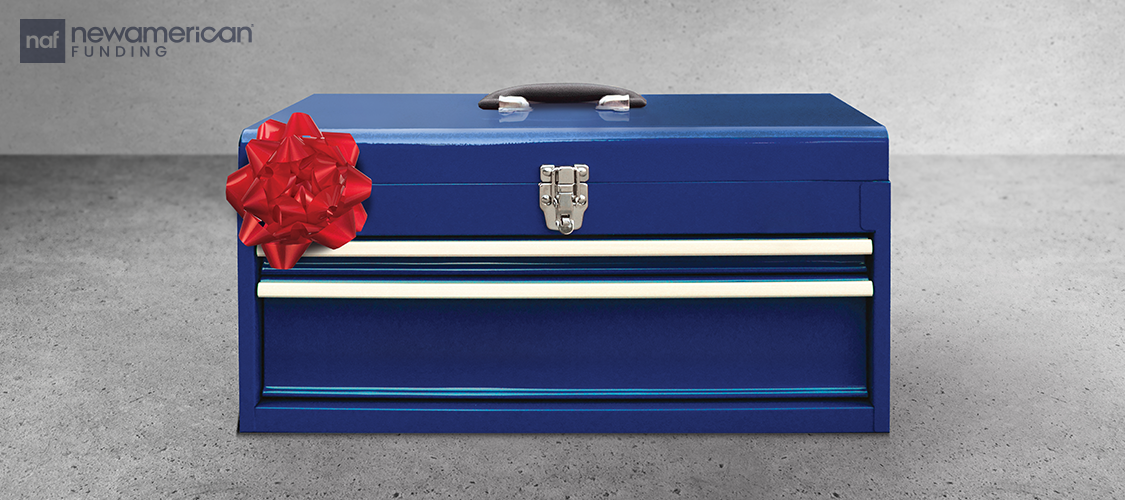 A blue tool box with a red bow.