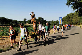 French Knights and other pilgrims wheel a statue of St. Joseph through the Burgundy countryside during the Great March of St. Joseph this past summer