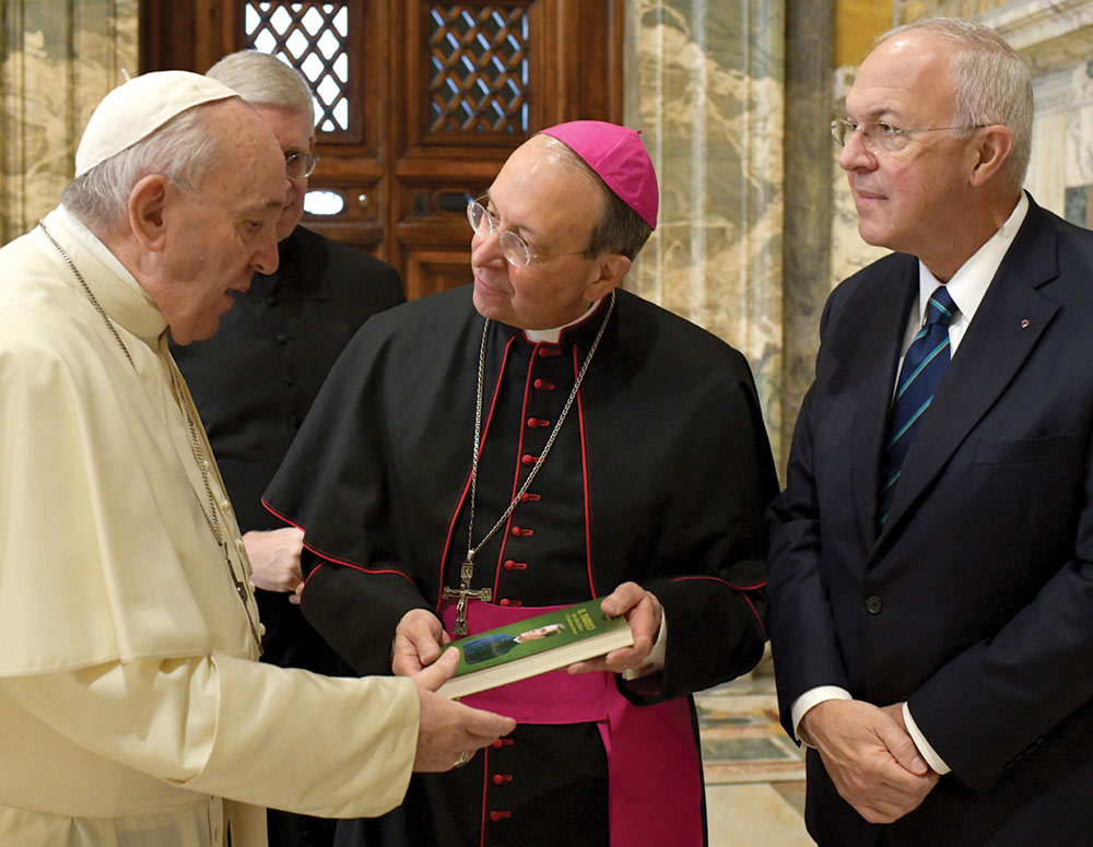 Pope Francis tells the K of C Board of Directors that the Order has been faithful &ldquo;to the vision of your founder, Venerable Michael McGivney, who was inspired by the principles of Christian charity and fraternity to assist those most in need.&rdquo; Supreme Chaplain Archbishop William Lori presents Pope Francis with a copy of Parish Priest in Italian.