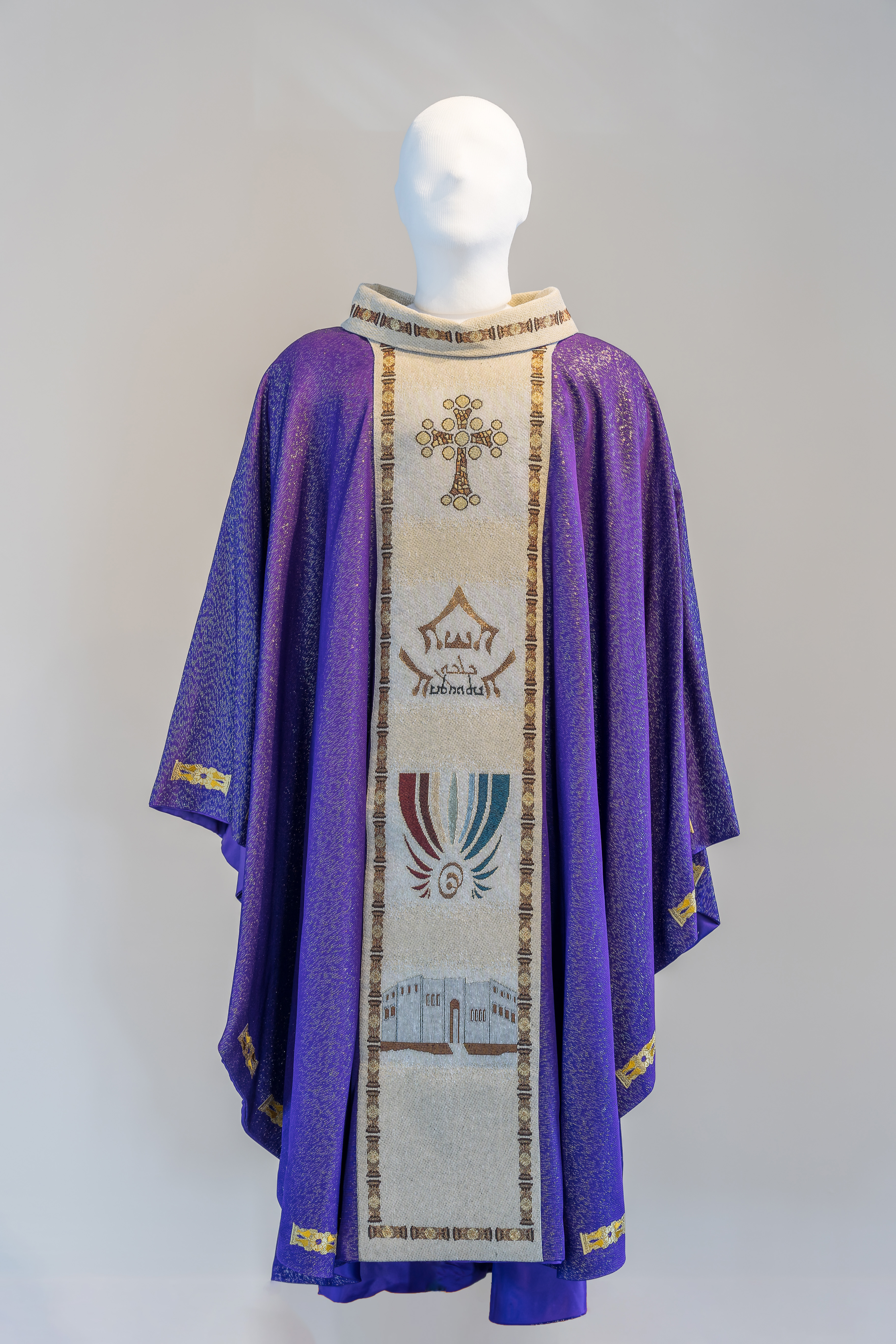 Purple chasuble embroidered on front and back on light brown band. 