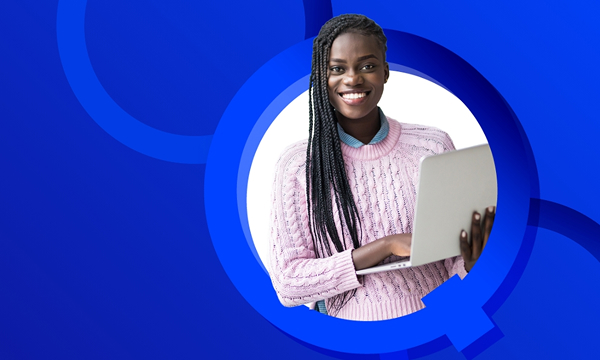 A smiling woman with long dark braids, wearing a light pink cable-knit sweater, holds an open silver laptop and looks directly at the camera. She is framed by a white and blue circular graphic background.