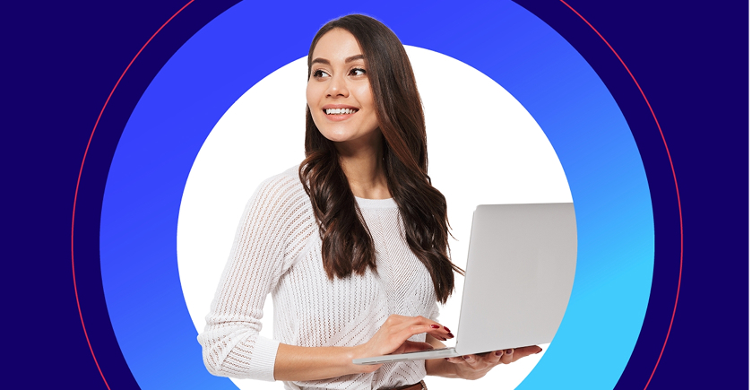 The image is a portrait of a smiling woman holding an open silver laptop. She has long, dark, wavy hair and is wearing a white, knitted sweater. She is looking up and to the side, appearing engaged and focused.