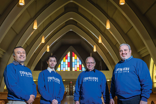 Past Grand Knight Francis McKen and other council members gather at the Church of Notre-Dame-de-Recouvrance in Québec City