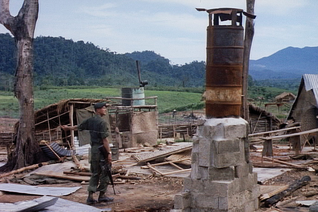 U.S. Army footage, Capt. Donlon surveys the ruined camp
