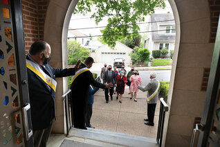 Grand Knight Joe Pargola (left) and other members of Father Joseph D. Gallagher Council 3673 welcome parishioners to Sunday Mass at Holy Trinity Catholic Church