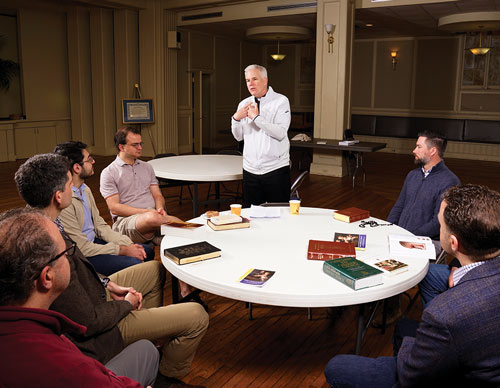 Father Vincent Curran gives a presentation on lectio divina, the prayerful reading of Scripture, to members of San Salvador Council 1