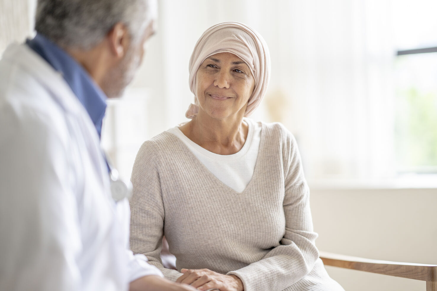 Brain cancer patient speaks with doctor