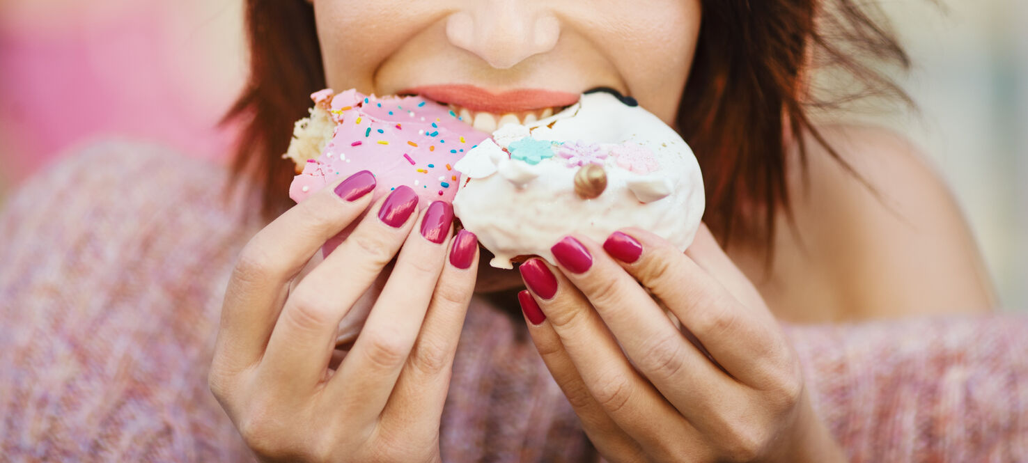 women eating sugary treats
