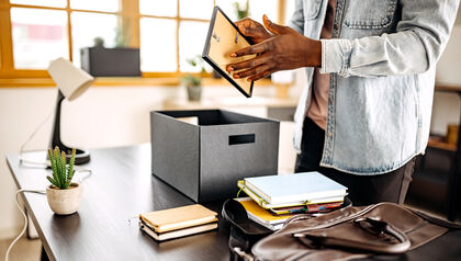 Casual businessman unpacking home office