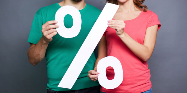 couple holding a percentage cutout