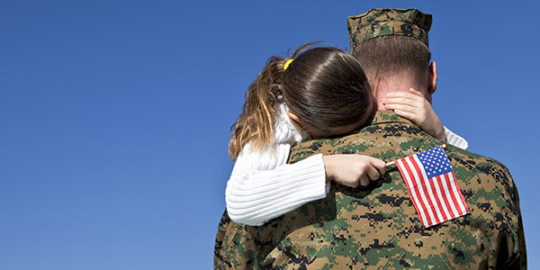 military father holding his daughter