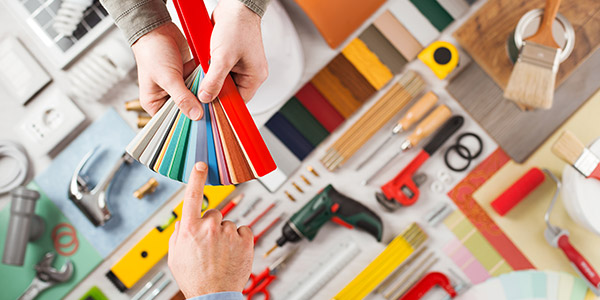 A person choosing a pain swatch