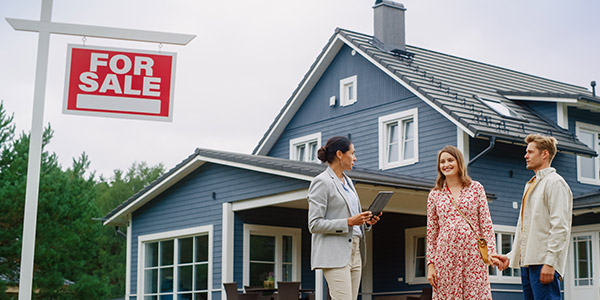 homebuyers viewing a house with their real estate agent