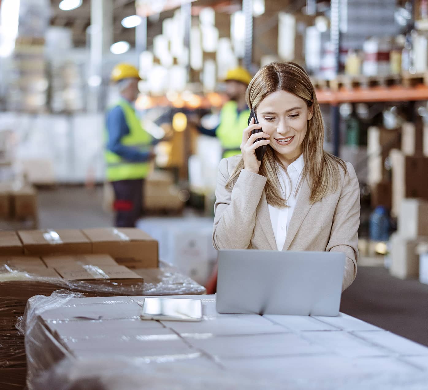 Warehouse worker looking at a laptop