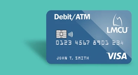Debit card on a seafoam green background