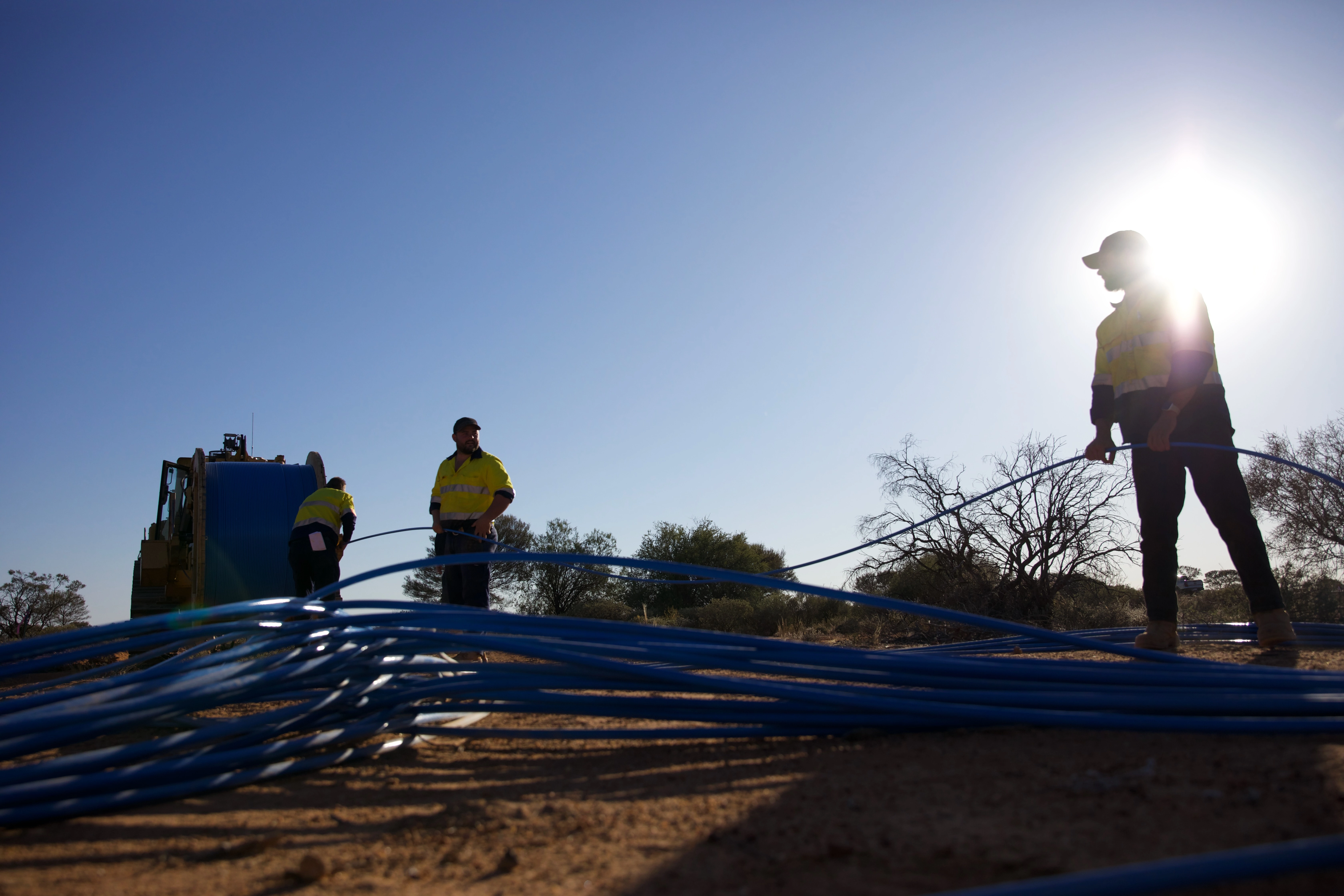 Technicians laying fibre